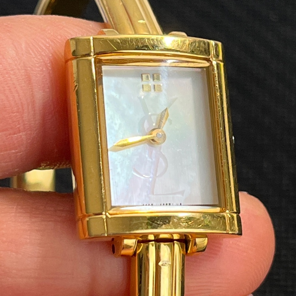 READ… YSL mother of pearl bangle ladies watch.